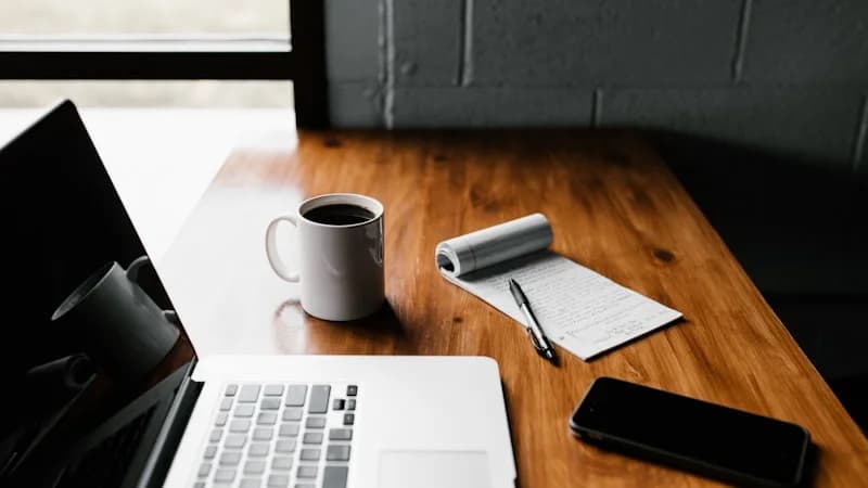 Comprehensive guide to affiliate marketing for beginners showing a creator workspace with laptop, analytics, and product links